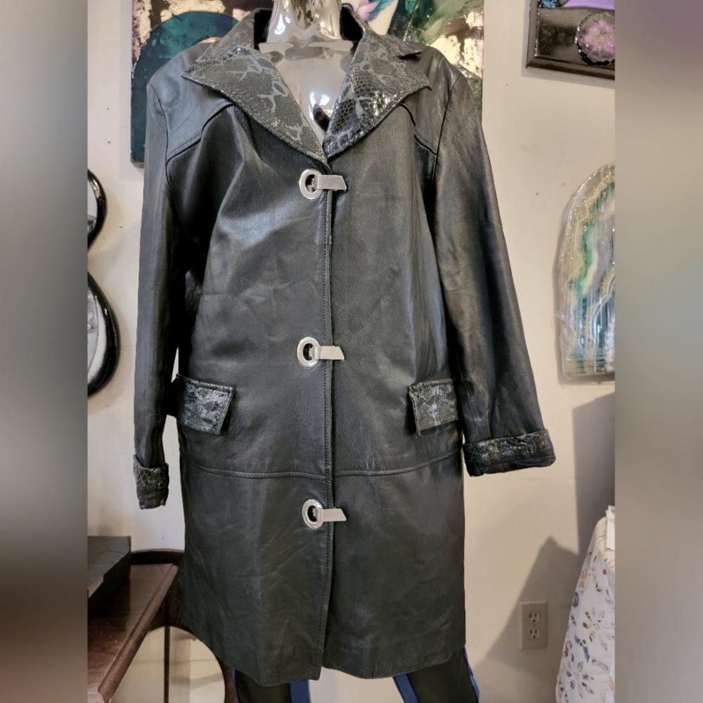 black jacket made of genuine leather with metal fasteners, size XL. $230